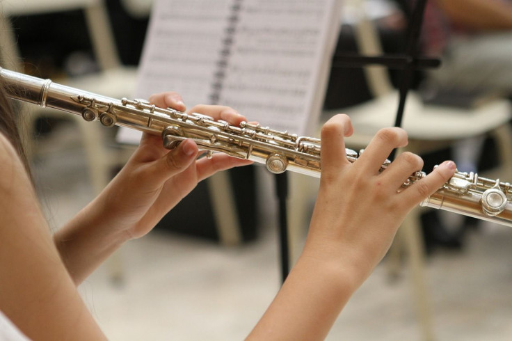 music teacher taints flute with semen before letting students use it