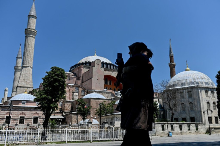 A woman takes a picture at the Hagia Sophia in Istanbul on July 2, 2020