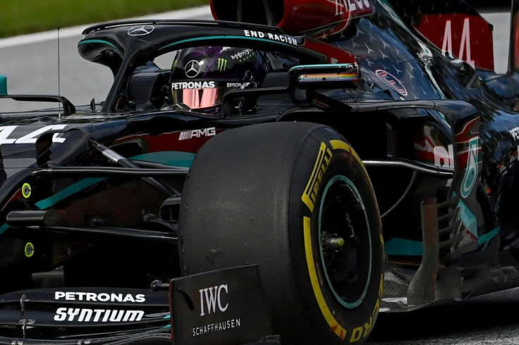 Back in black: Lewis Hamilton steers his car to the day's top time