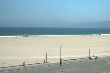 While some people are seen walking around 3rd Street Promenade, Santa Monica State Beach and the Pier lie empty on the July 4th holiday amid growing concerns over the spread of the coronavirus in California