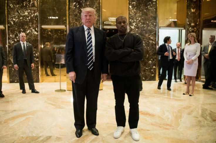 Donald Trump and Kanye West stand together in the lobby at Trump Tower, December 13, 2016 in New York City, after Trump's election victory -- but West apparently now wants to deny him a second term by running himself