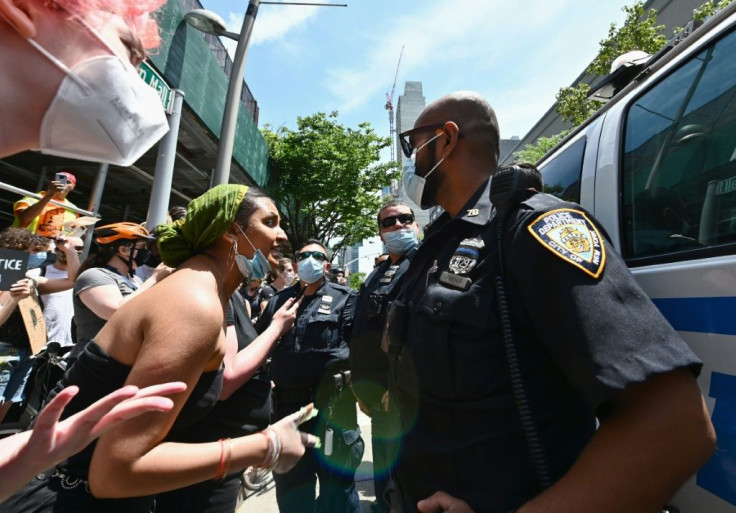 Protesters and police in Brooklyn on 17 June 2020