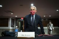 Anthony Fauci, the top US infectious disease expert, has warned that the country is still 'knee-deep' in its first coronavirus wave