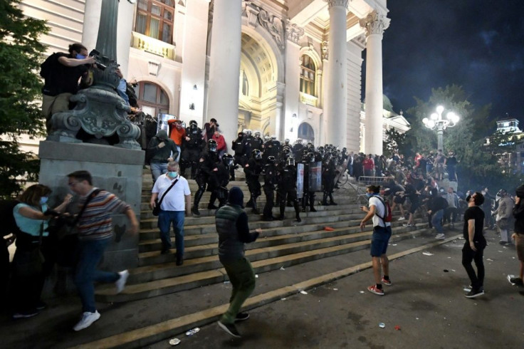 Serbian police fires tear gas in front of the National Assembly building in Belgrade, on July 7, 2020, to disperse thousands of protesters angry at the return of a weekend coronavirus curfew