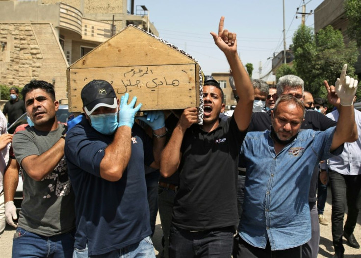 Mourners carry the coffin of Iraqi jihadism expert Hisham al-Hashemi, who was shot dead outside his house in the Iraqi capital