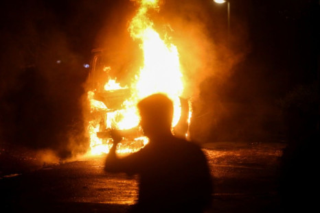 Police cars and rubbish bins were set alight during the protests