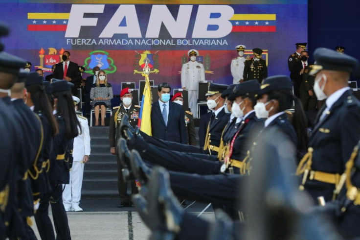Venezuela President Nicolas Maduro (center) takes part in a ceremony to hand out promotions to military officers