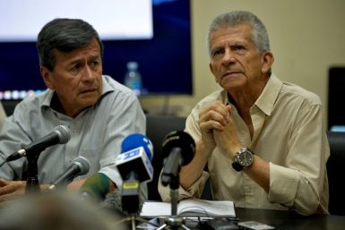 Pablo BeltrÃ¡n (left) and Aureliano Carbonell, pictured in July 2019, represented the ELN in Cuban-hosted peace talks with the Colombian government