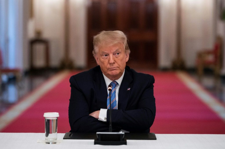 US President Donald Trump sits with arms crossed during a Wite House roundtable discussion on the Safe Reopening of America's Schools on July 7, 2020