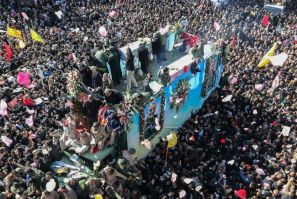 Iranian mourners gather in January 2020 around a vehicle carrying the coffin of slain top general Qasem Soleimani, whose killing by the United States a UN expert has concluded was unlawful