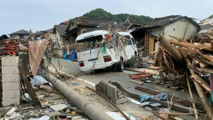 Debris is seen piled up on the streets of a Japanese village Kumamura following torrential rain in the country's south.