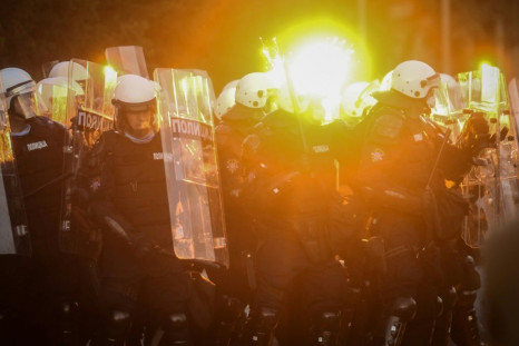 Protestors clash with police in Belgrade on July 8, 2020 as violence erupts against a weekend curfew announced to combat a resurgence of COVID-19 infections