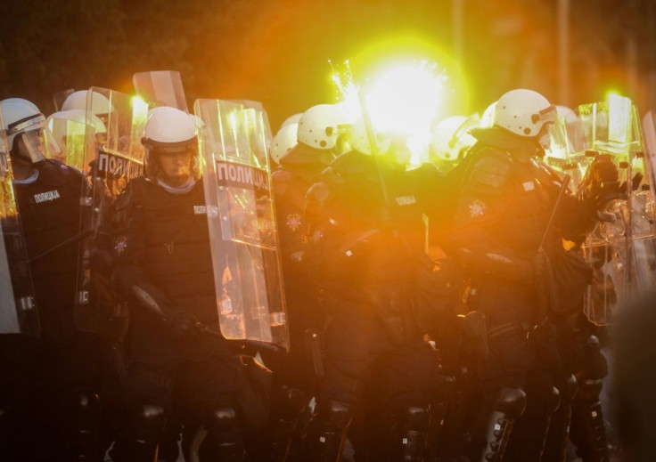 Protestors clash with police in Belgrade on July 8, 2020 as violence erupts against a weekend curfew announced to combat a resurgence of COVID-19 infections