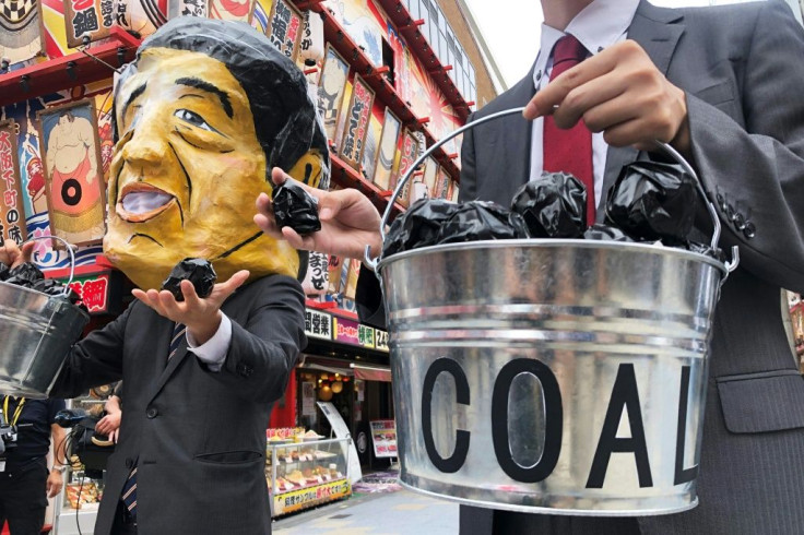 Protesters wearing masks of world leaders including Japanese Prime Minister Shinzo Abe demonstrated against climate change and coal during the G20 summit in Osaka in June 2019