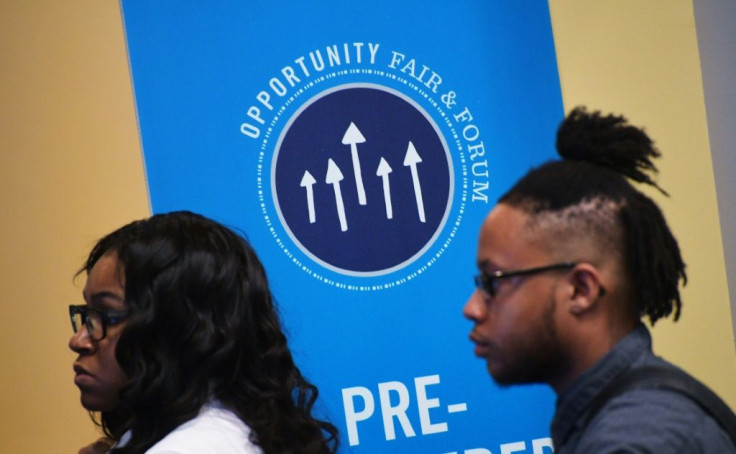 In this 2017 file photo, job seekers arrive for The Opportunity Hiring Fair in Washington, DC