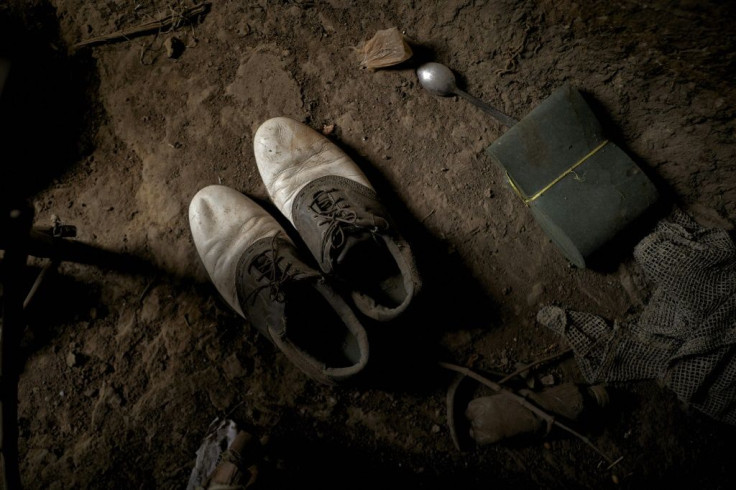 Personal objects that belonged to one of the victims are laid out by family in his home