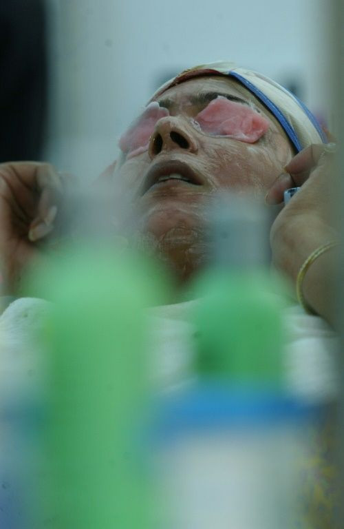 A woman in India undergoes a skin treatment