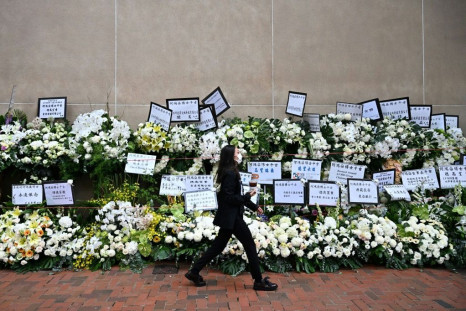 Floral wreaths were left near the funeral venue