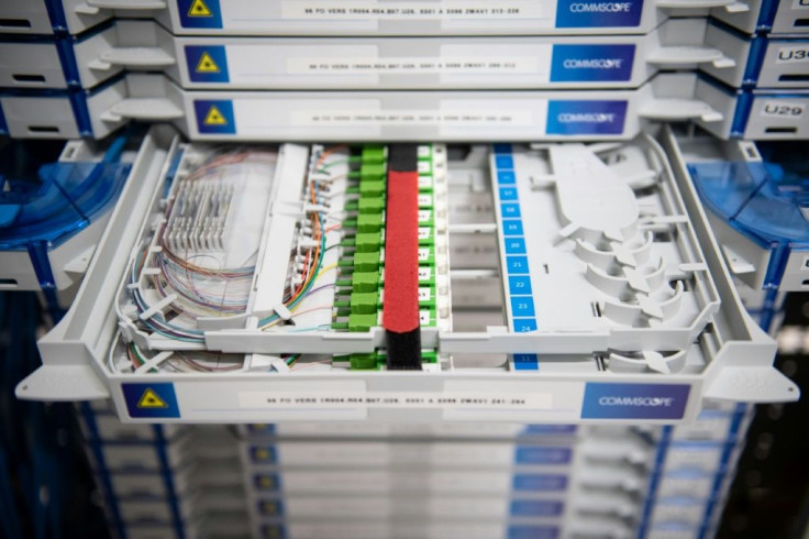Racks of optical interconnection drawers link data servers to the many fibre optic data cables that link up in Marseille
