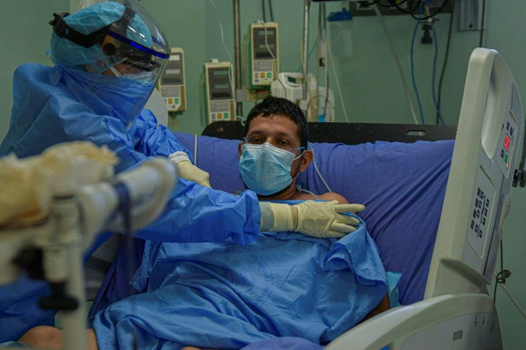 Dr Giselle Sanchez attends to a COVID-19 patient in Panama where 20 percent of people that catch the coronavirus end up in hospital, and five percent in intensive care