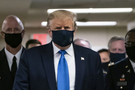 US President Donald Trump wears a mask as he visits Walter Reed National Military Medical Center in Bethesda, Maryland on July 11, 2020
