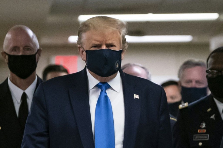 US President Donald Trump wears a mask as he visits Walter Reed National Military Medical Center in Bethesda, Maryland on July 11, 2020