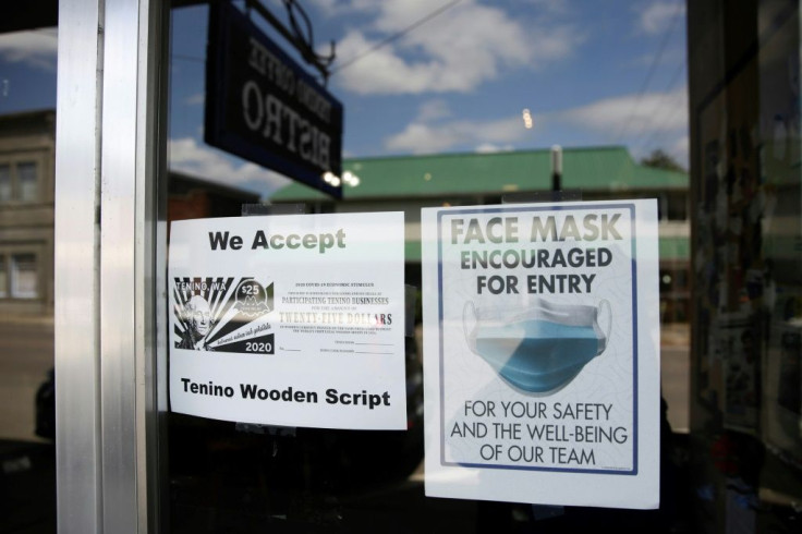 A sign at Tenino Coffee Bistro in Washington state announces the shop accepts the city's wooden money, created to help businesses hit hard by the coronavirus pandemic