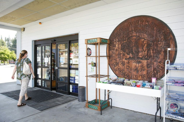 A huge facsimile of a wooden nickel outside a pharmacy in Tenino announces the small town in Washington state as the US birthplace of wooden money
