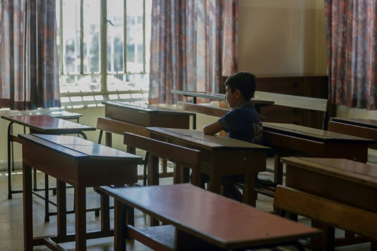 A Lebanese pupil looks out of the window