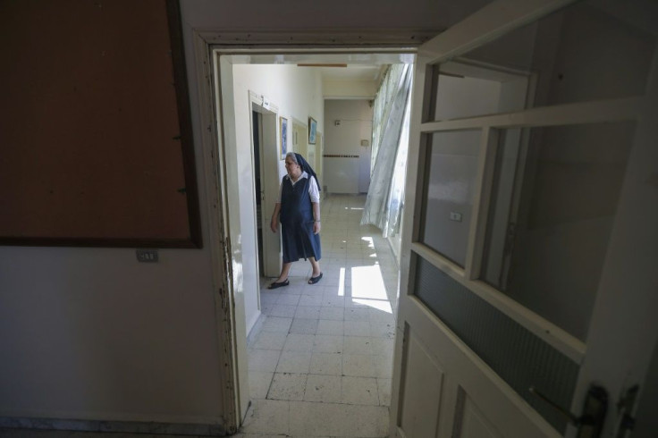 A nun walks down an empty hallway at Our Lady of Lourdes school in the Lebanese city of Zahle. French-speaking schools are mostly private and a majority are of them Catholic