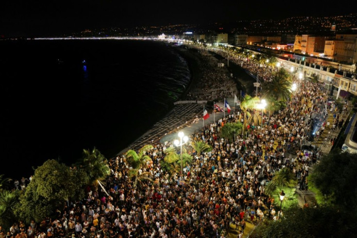 Crowds massing on Nice's  Promenade des Anglais esplanade for electro house music producer The Avener's set