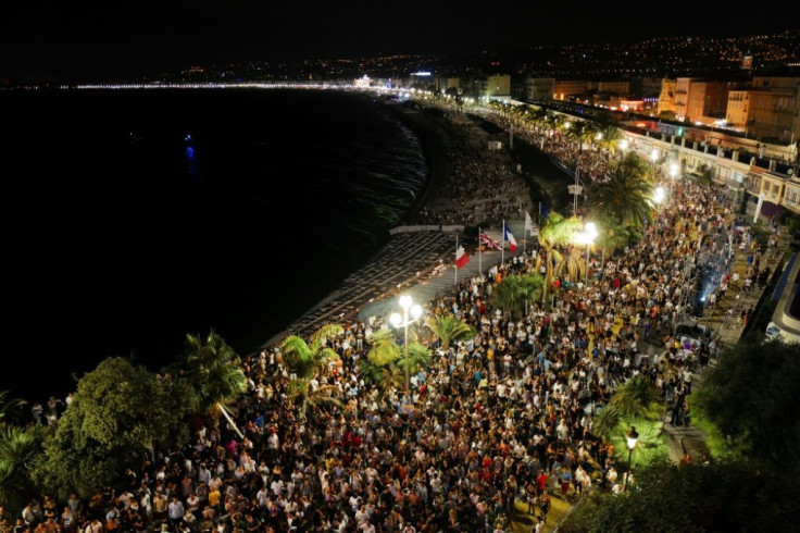 Crowds massing on Nice's Promenade des Anglais esplanade for electro house music producer The Avener's set