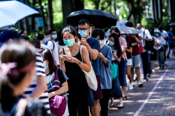 Hundreds of thousands queued to vote at polling stations across the city despite the intense summer heat