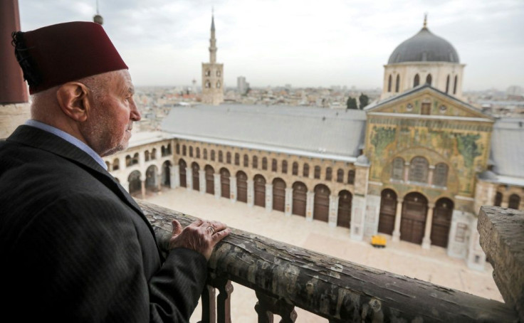 A March 12 file photo shows Mohammad Ali al-Sheikh, the eldest of the muezzins who call Muslims to prayer, on a balcony of the Umayyad Mosque in the ancient quarters of Damascus
