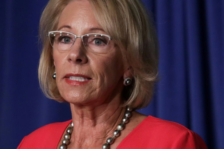 Education Secretary Betsy DeVos, seen in a July 8, 2020 White House briefing, has insisted that schools across the country must aim for full reopenings in the fall, saying they otherwise risk losing federal funds
