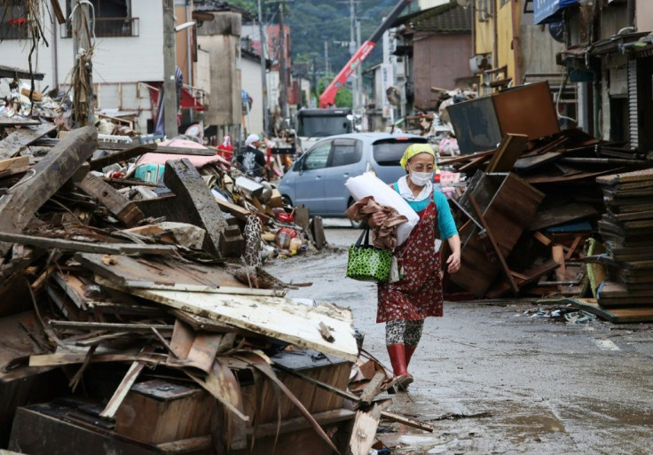 At least 72 people are confirmed to have died in torrential rains in Japan that triggered flooding and landslides