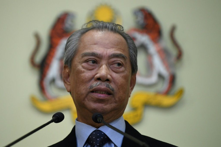 Malaysia's Prime Minister Muhyiddin Yassin, seen here in March, is at the head of a coalition backed by a scandal-plagued party