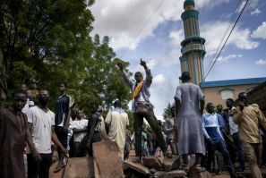 Protesters at a barricade erected in front of the Salam Mosque in Bamako, where Imam Mahmoud Dicko, a leader of the anti-government movement, led prayers on Sunday for victims of the clashes