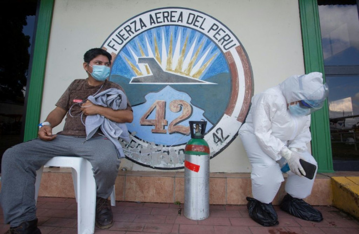 Exhausted medical workers in Peru, as Latin America's number of coronavirus deaths passed the US and Canada on Monday