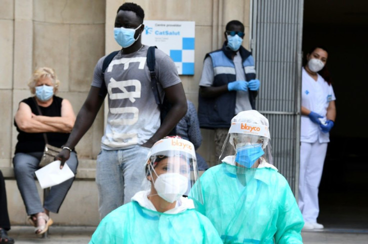 Healthcare workers in the Spanish town of Lerida, where a lockdown order was blocked by a local court