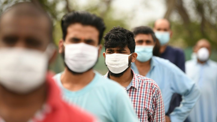 Migrant workers in Dubai wearing protective masks in April received Iftar meals during the Muslim holy month of Ramadan