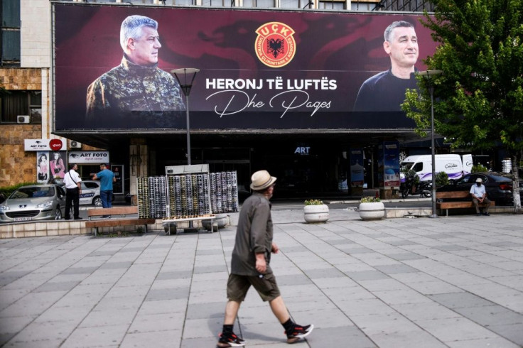 Billboards in Pristina proclaim Kosovo President Hashim Thaci (L) and ex-parliament speaker Kadri Veseli (R) as "heroes of war and peace"