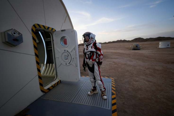 A woman wearing a spacesuit at a Chinese Mars simulation base in the Gobi desert in April 2019