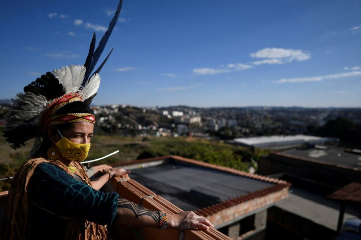 Angoho, an indigenous woman of the Pataxo Ha-ha-hae community, wears a face mask at the Vila Vitoria favela on the outskirts of Belo Horizonte, Brazil