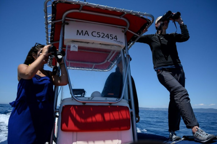 Environmentalits Marion Leclerc and Laurene Trudelle monitor the sea