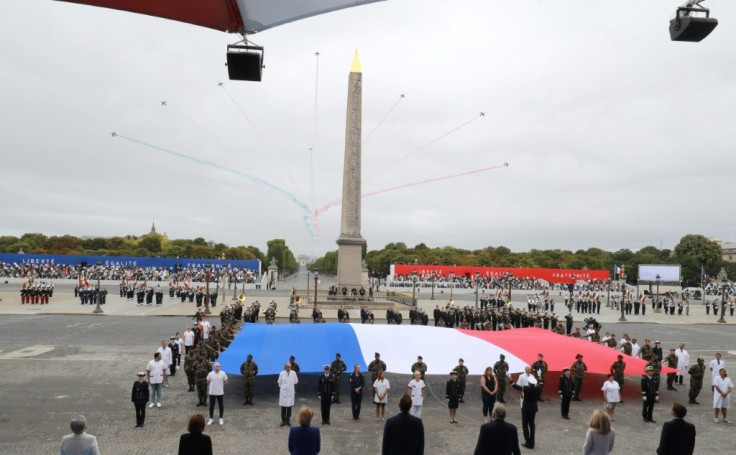 Doctors, nurses and other medical workers wore their white coats as they were saluted with the national anthem "La Marseillaise."