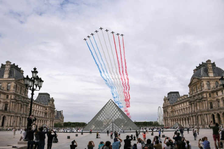 French elite acrobatic flying team "Patrouille de France" (PAF) performs a flying display of the French national flag