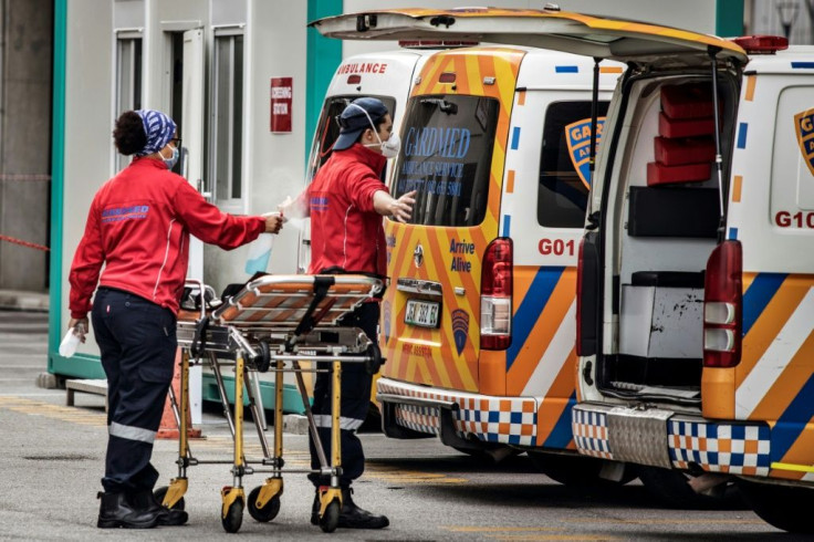Ambulance crew sanitise their clothes at Greenacres Hospital in Port Elizabeth