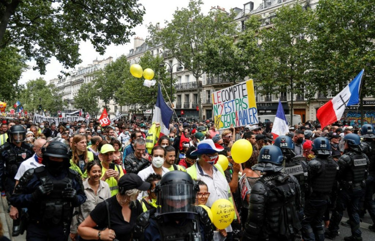 Protesters marched to demand more pay and resources for health workers in Paris, a day after the government announced an eight billion euro package for pay raises.