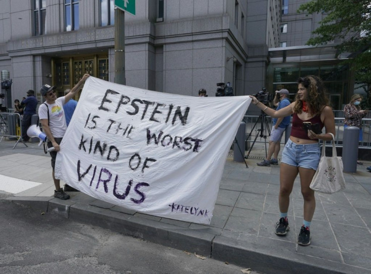 Protestors gather outside court as Ghislaine Maxwell is arraigned in a New York court via video-link on July 14, 2020